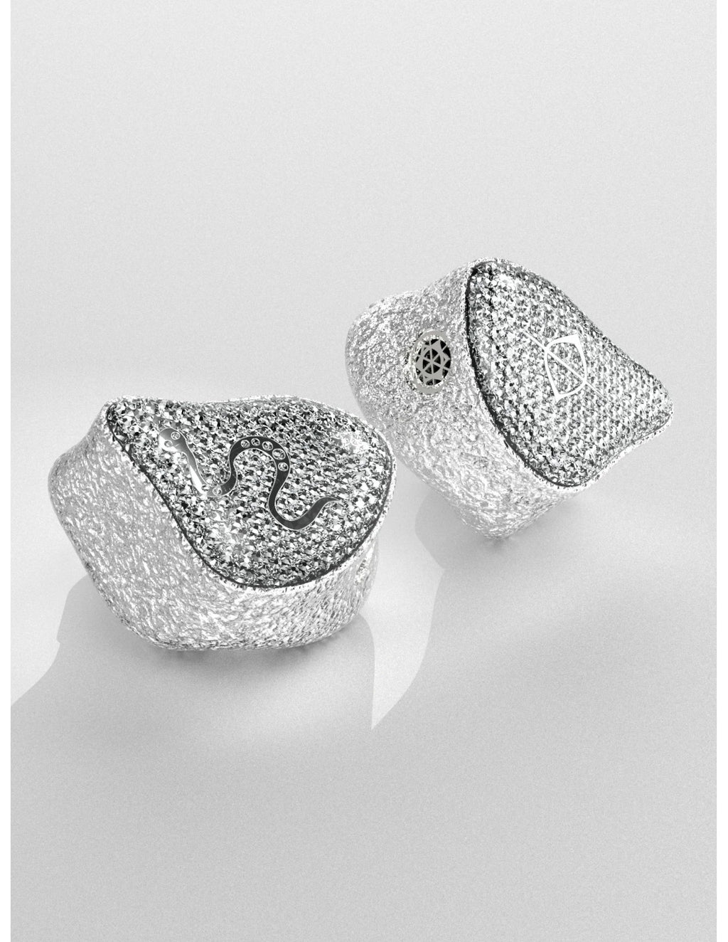 Close-up pair of silver mesh EarAcoustic SPA limited edition earbuds