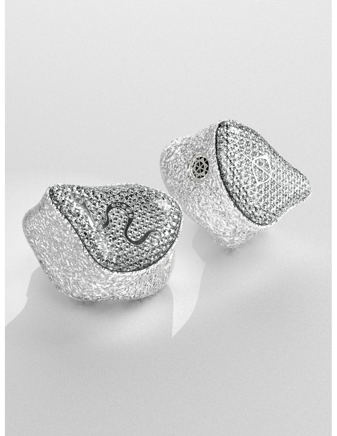 Close-up pair of silver mesh EarAcoustic SPA limited edition earbuds