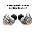 A pair of in-ear monitors labeled 'EarAcoustic Audio Golden Snake II' on a white background. The earbuds feature textured silver outer shells with a gold snake design and black silicone ear tips.