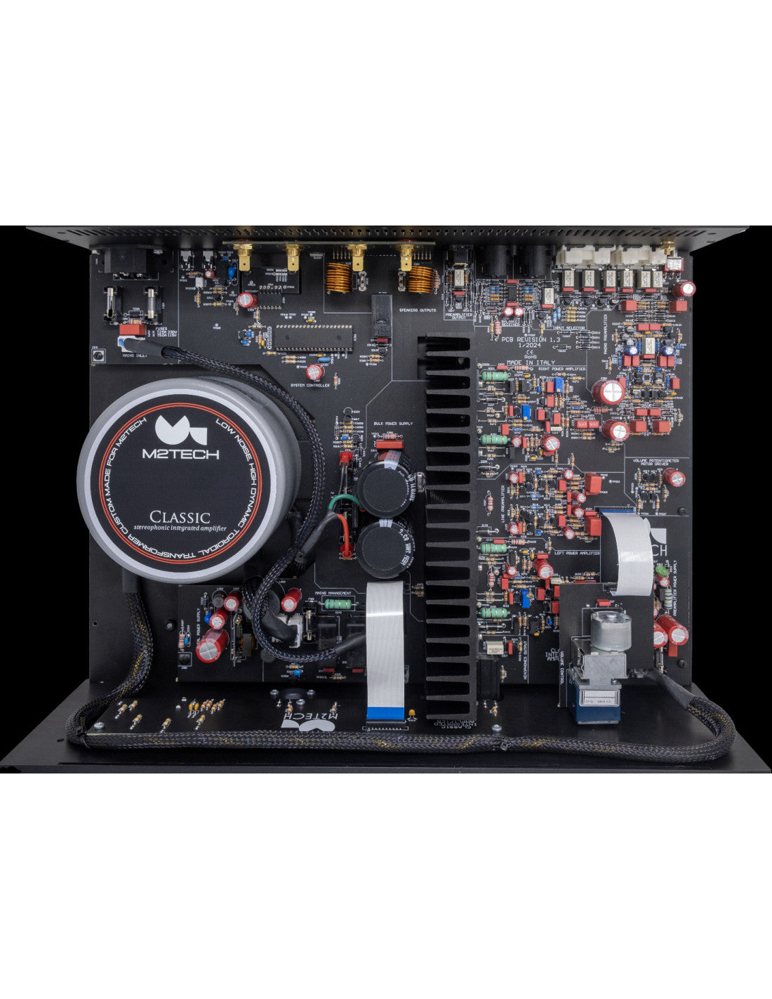 Stereophonic amplifier open chassis showing circuit boards and large cooling vent