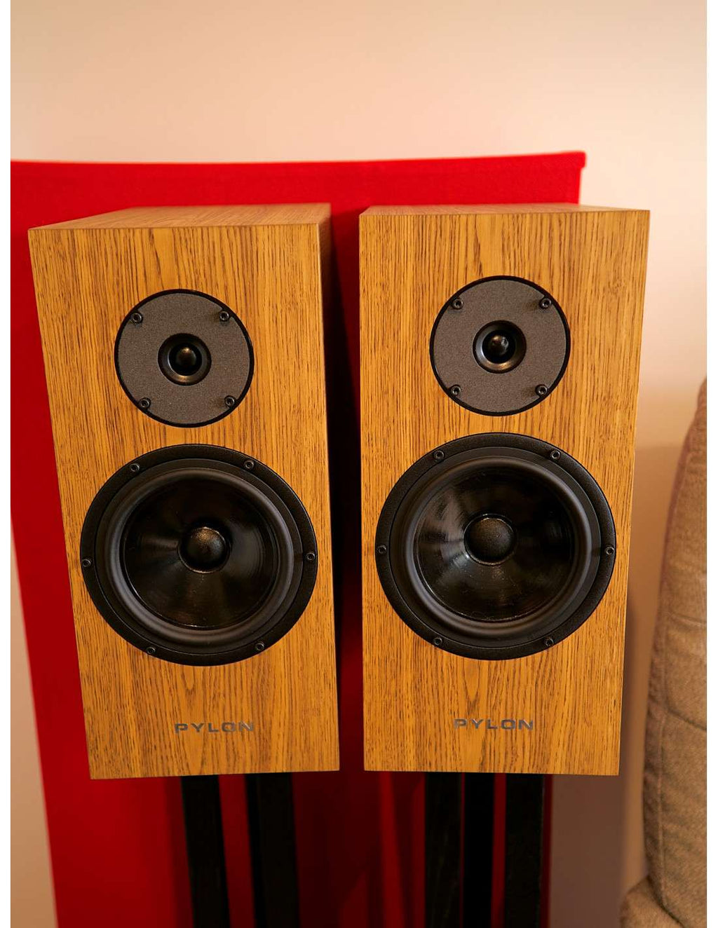 Dark oak bookshelf speaker cabinets with black tweeters and large woofers
