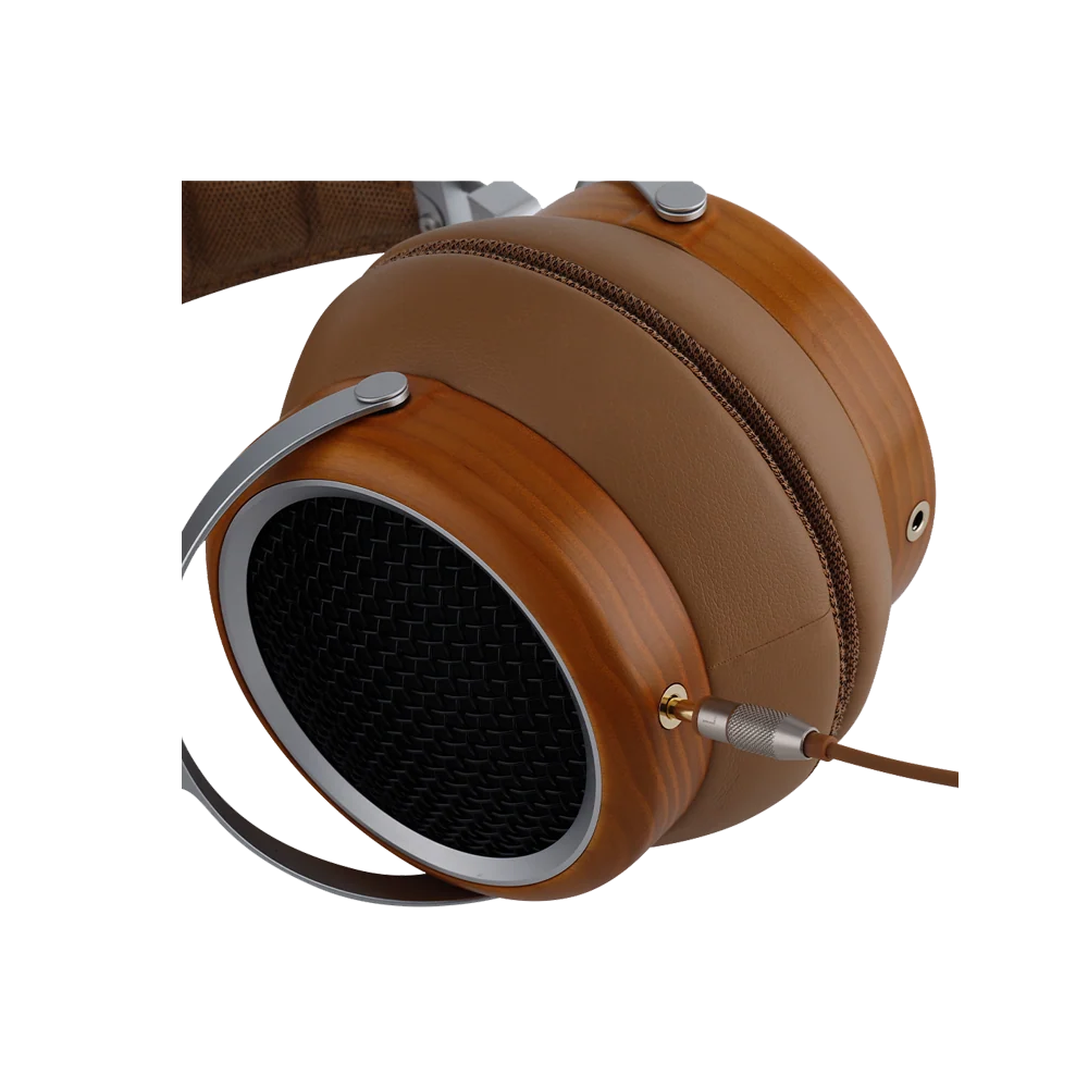 A close-up of a brown over-ear headphone with a wood-grain finish, silver metal accents, and a black mesh speaker grille, shown on a plain white background.
