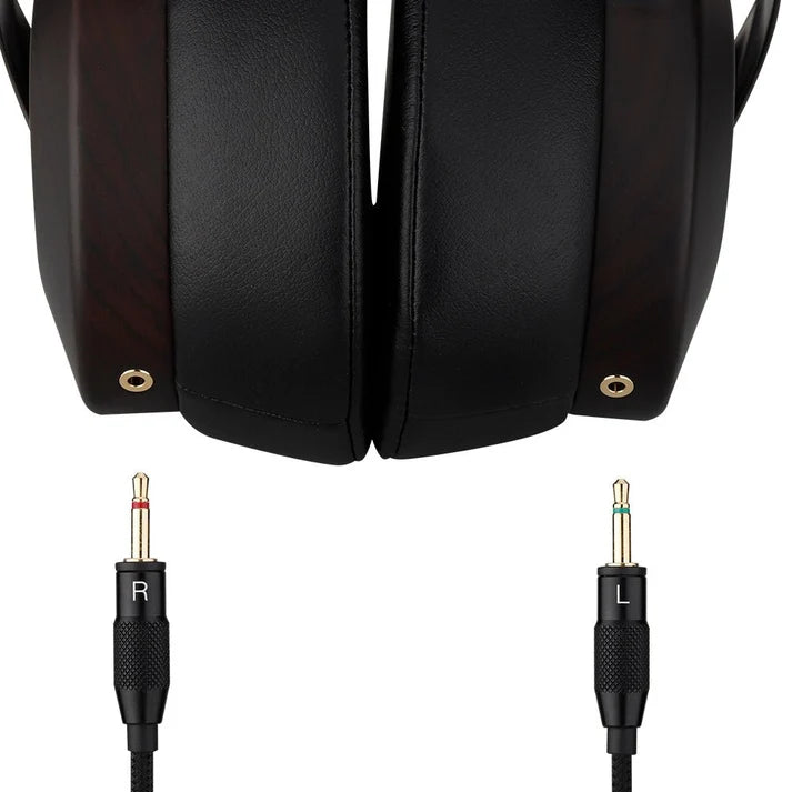 Black over-ear headphones with textured ear cushions and detachable 3.5mm audio plugs