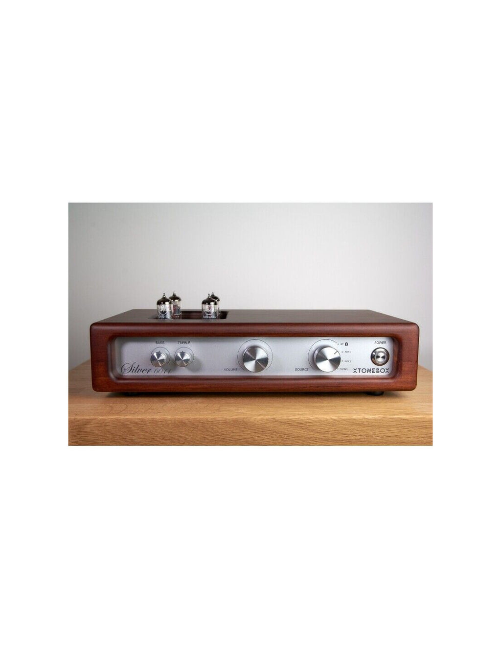 Sunburst tube amplifier front view with silver dials, toggle controls, and tube sockets